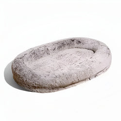 Human giant dog bed in grey photographed on a white background