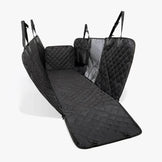 Black quilted hammock fully installed with visible mesh divider