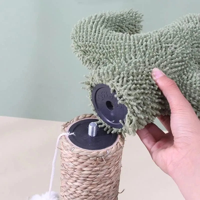 Hand assembling a cactus scratching post for cats by attaching the plush cactus top to the sisal base