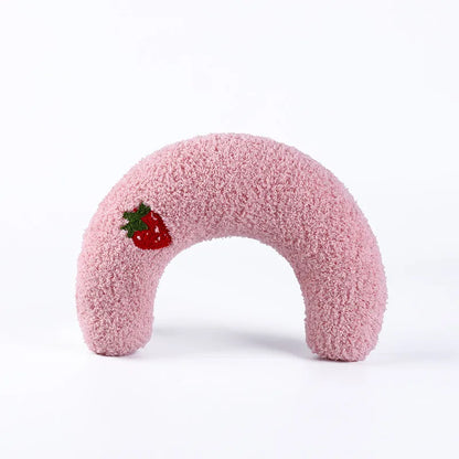 Cozy pink calming pet pillow shaped like a donut, featuring a cute strawberry design for added charm.