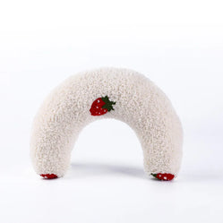 Soft white calming pet pillow shaped like a donut, adorned with a cute strawberry design for added appeal.