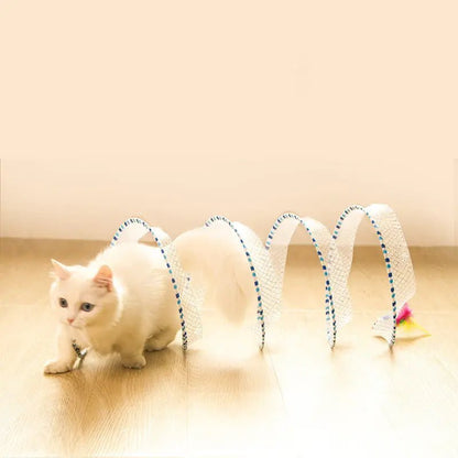 White cat playing with a spiral cat toy, offering fun and exercise while keeping your pet entertained and active.