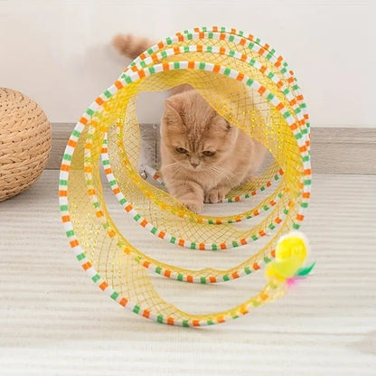 Cat playing inside a colorful spiral tunnel toy, providing fun, exercise, and mental stimulation for indoor cats.