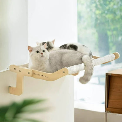 Cozy cat window hammock with sturdy wooden frame, offering a comfortable sunbathing spot for cats indoors.