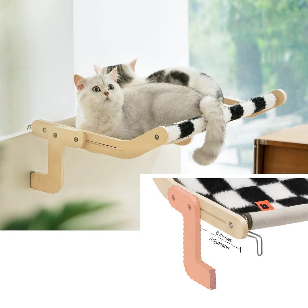 Cat lounging on a cozy window hammock with adjustable support, perfect for sunbathing and relaxation.