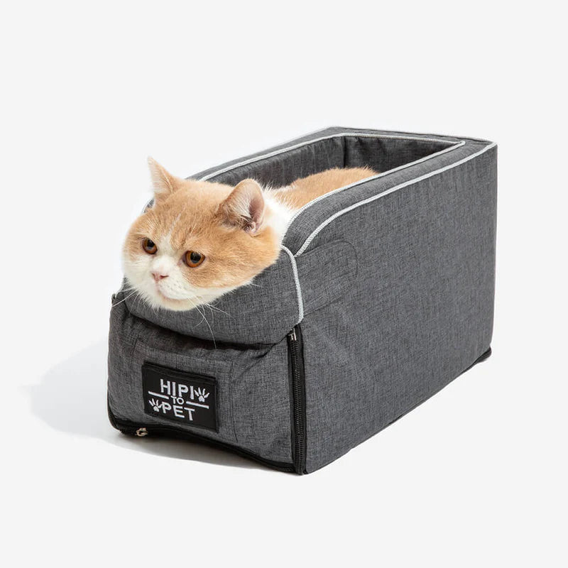 Cat car seat for console with a cat resting in studio.