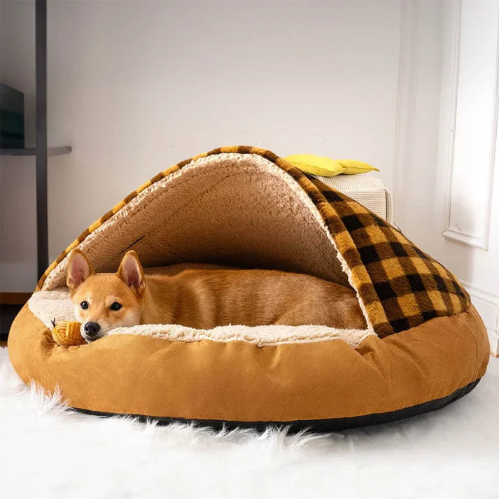 Cozy covered dog bed in brown plaid design, featuring a relaxed dog lying inside for warmth and comfort in style.