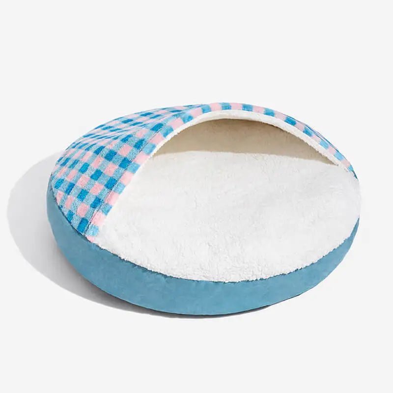 Blue and pink plaid cozy covered dog bed with soft plush interior, ideal for small to medium-sized dogs seeking comfort.