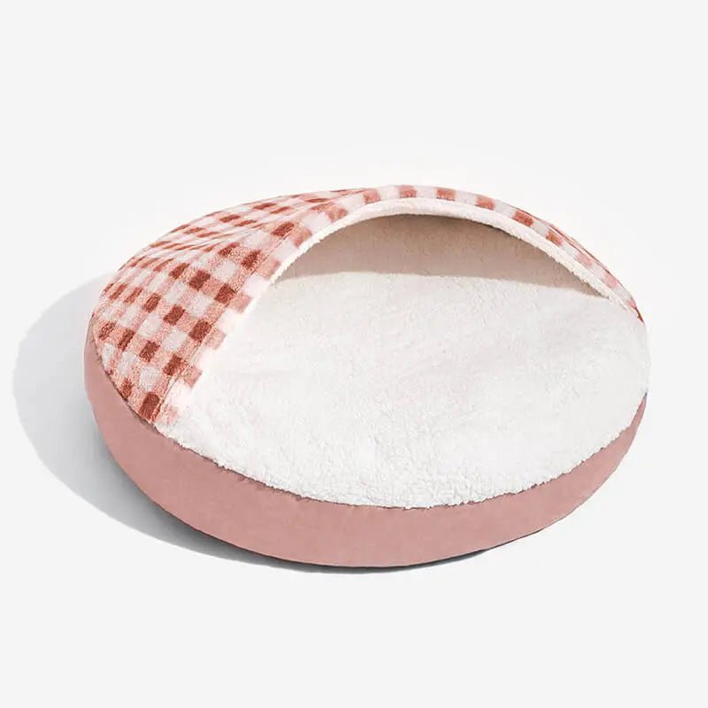 Cozy covered dog bed with soft plush lining and red checkered hood, providing warmth and comfort for small to medium pets.