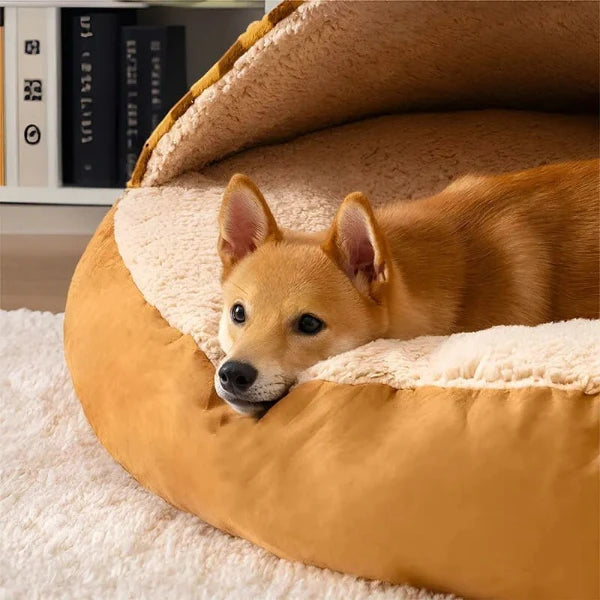 Cozy covered dog bed with blue and pink plaid design, providing soft plush comfort for dogs seeking warmth and security.