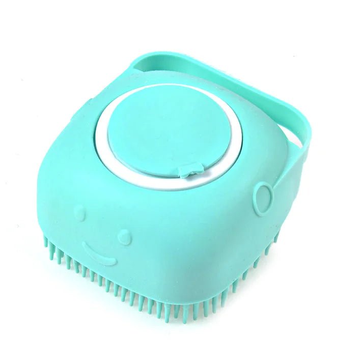 Close-up of a turquoise silicone dog bath brush with a built-in shampoo dispenser, perfect for easy pet grooming and bathing.