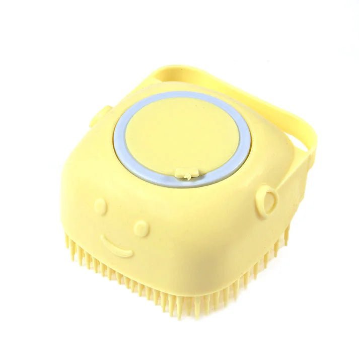 Yellow silicone dog bath brush with shampoo dispenser, designed for easy pet grooming and efficient bathing.