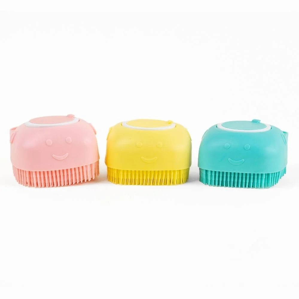 Colorful dog bath brushes with shampoo dispensers in pink, yellow, and teal. Gentle grooming tools for pets' bath time.