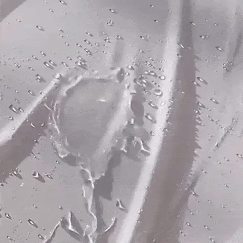water beads on the fabric to show a waterproof dog bed