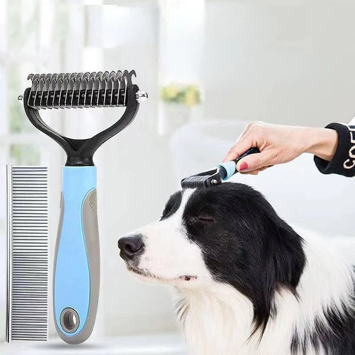 A hand using a shedding brush for dog on a black and white coat indoors
