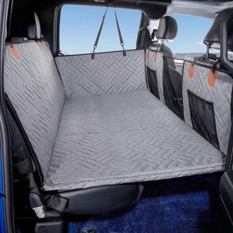 gray back seat extender cover for dogs installed across the rear seat