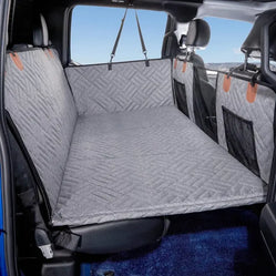 gray back seat extender cover for dogs installed across the rear seat