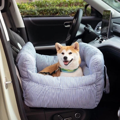 Shiba Inu dog enjoying a striped blue dog car seat with seatbelt for safe and comfortable travel in the car.