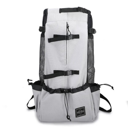 Adjustable dog carrier backpack in gray, designed with breathable mesh and secure straps for comfort.