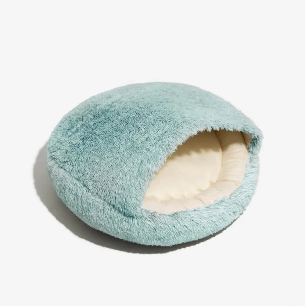 Mint green plush cave-style pet bed with padded inner cushion