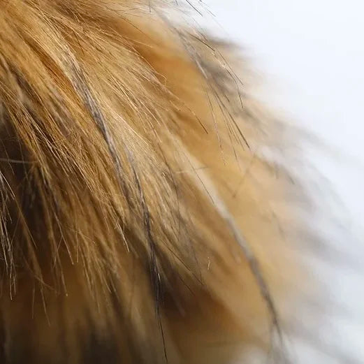 Close-up of brown fur trim on a dog winter jacket with hood