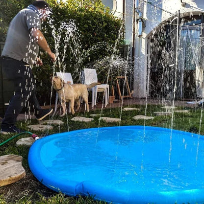 Man and dog enjoying playtime with a Dog Pool featuring sprinklers, perfect for outdoor pet fun and cooling off.