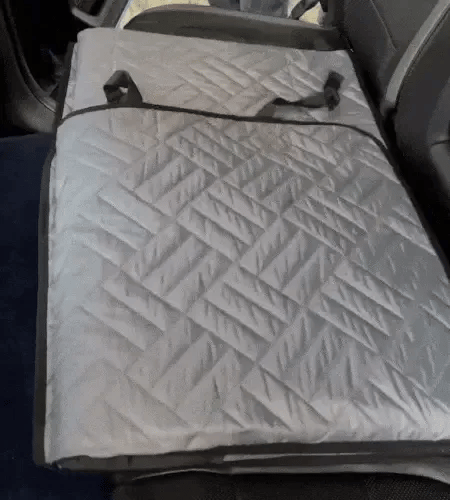 back seat dog cover attached and opened across the rear seats of the car