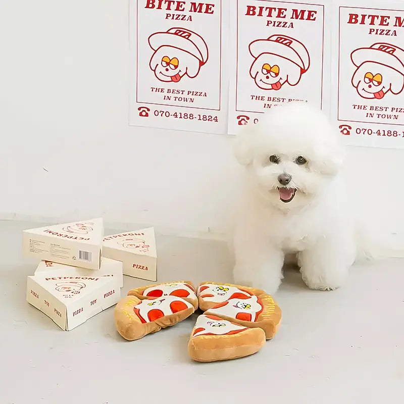 pizza plush dog toy set with a fluffy white dog sitting beside the pizza slices and boxes