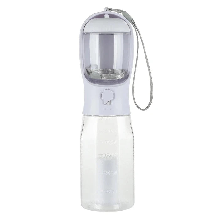 Portable grey dog travel water bottle with 600ml capacity, built-in food container, and waste bag dispenser for outdoor trips.