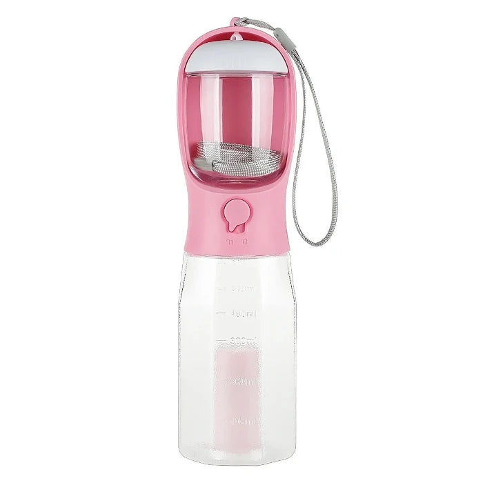 Pink portable dog travel water bottle with 600ml capacity, integrated food container, and waste bag holder for outdoor use.