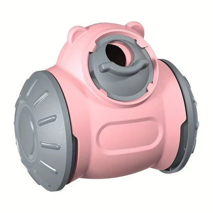 Interactive pink and gray dog treat dispenser toy with rotating design for mental stimulation and fun reward-based play.