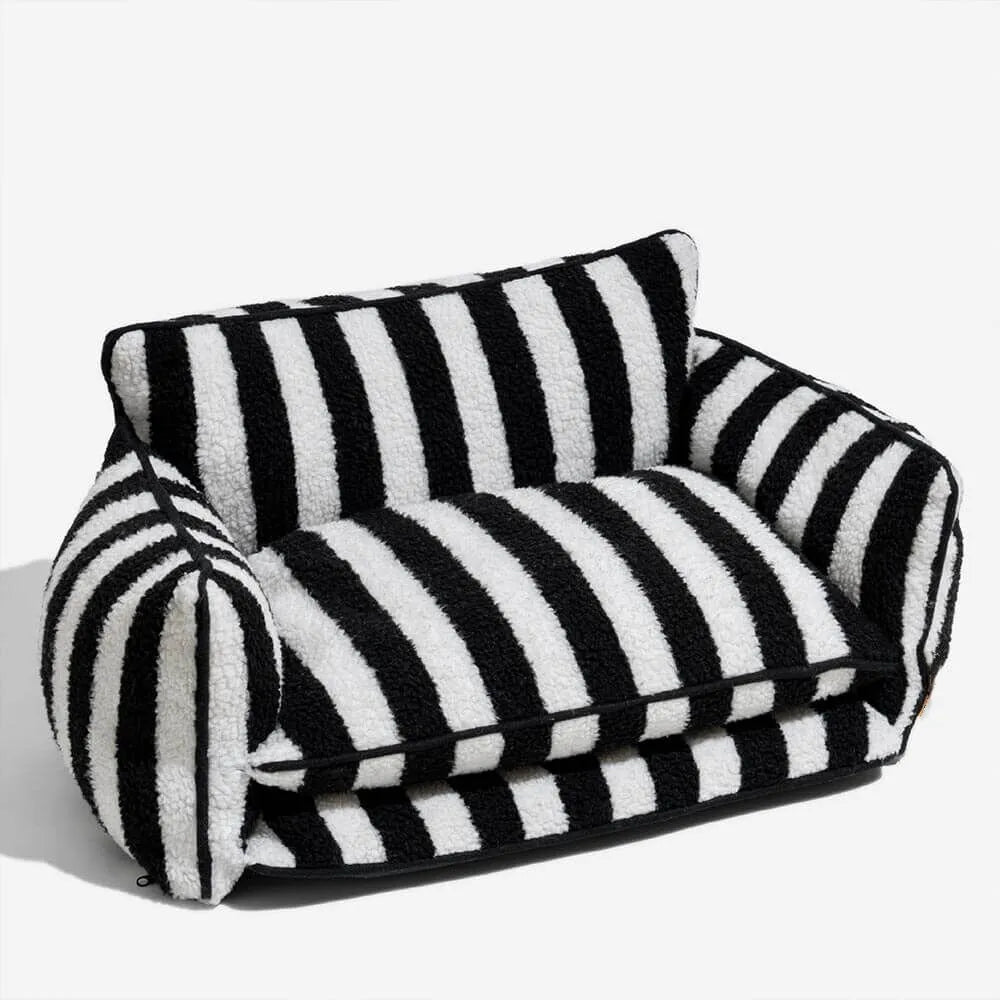 Black dog sofa bed with striped plush fabric on a white background