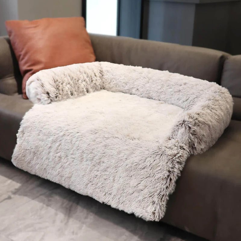 Light gray fluffy dog couch bed with pillow, offering cozy comfort and protection for your pet and furniture.