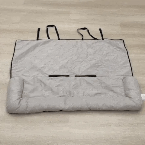Dog seat protectors for cars shown folded with carry strap