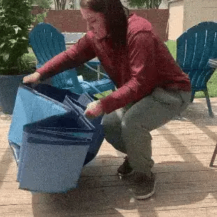 Woman unfolding a portable pool for dogs on the patio for quick setup