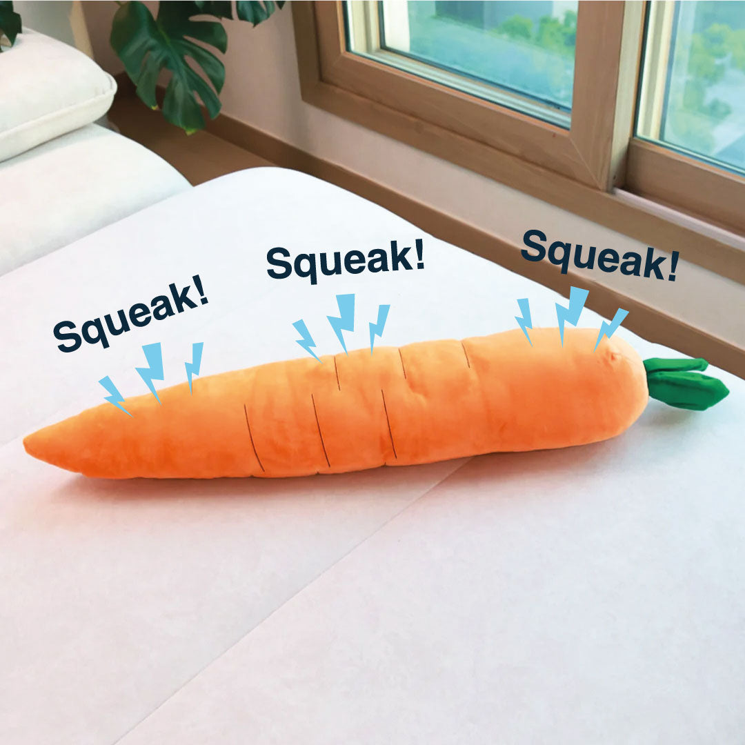 Giant carrot-shaped squeaky plush dog toy, designed for interactive play and fun.