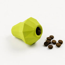 green hide treat pet toy lying on its side with treat on a light background