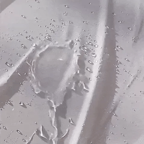 water beads on the surface to show a waterproof small oval dog bed