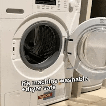 washable floor mats for dogs shown next to an open washing machine