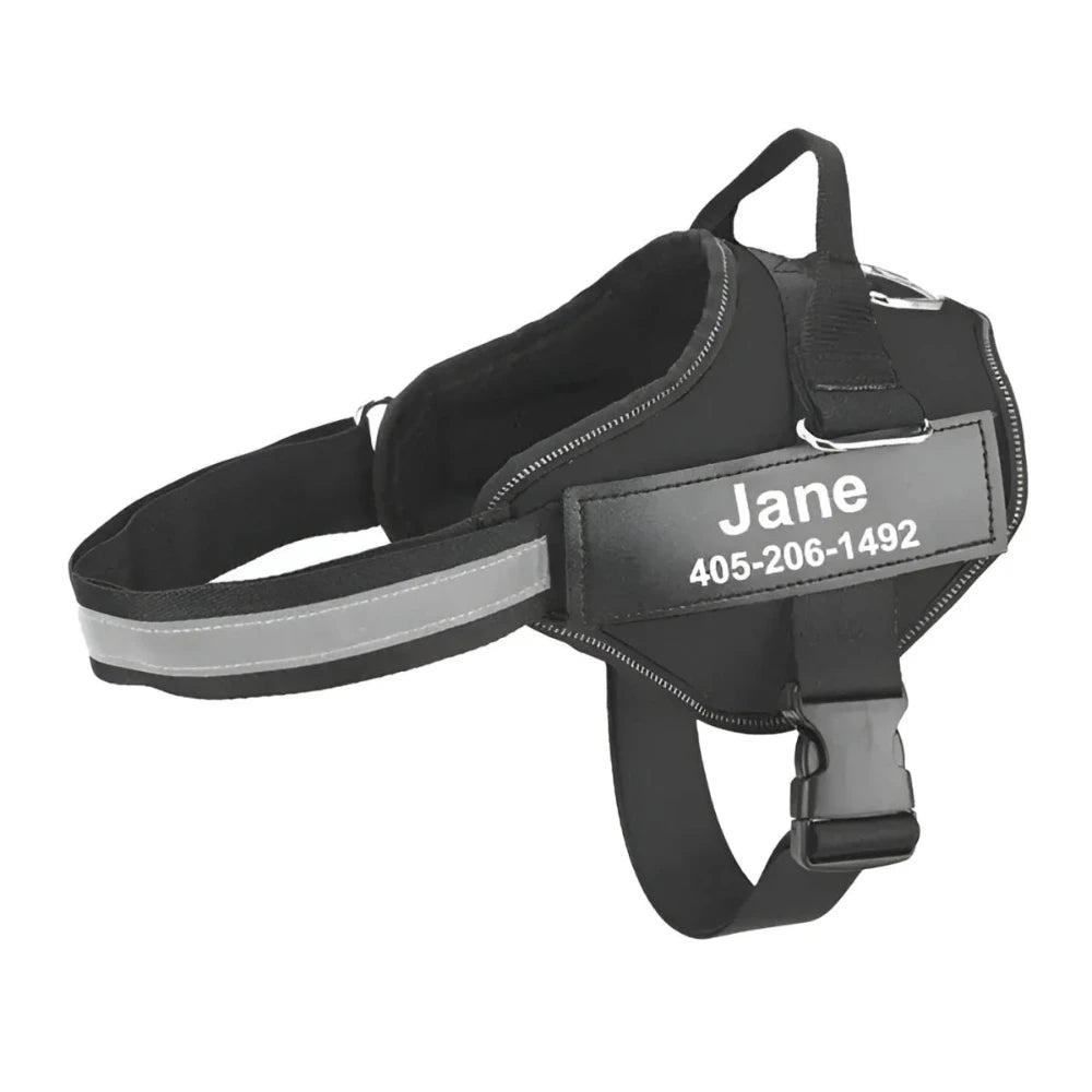 Black personalized dog harness with a custom name on a white background