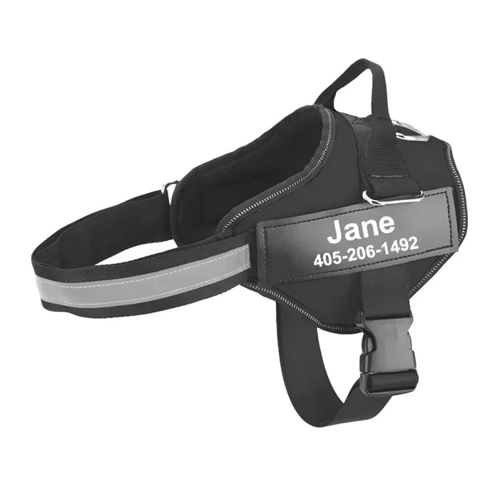 Black personalized reflective dog harness with custom name tag and phone number for safety and nighttime visibility.