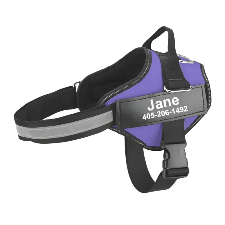Purple personalized reflective dog harness with custom name tag and phone number, offering safety and visibility.