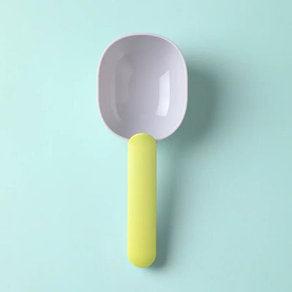 Gray pet food scoop with bright yellow handle, perfect for scooping dry pet food. Durable and easy-to-use design for daily feeding.