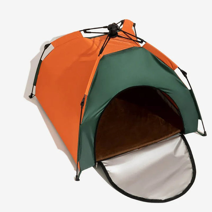 Portable cat tent in orange and green with the front flap open in the studio