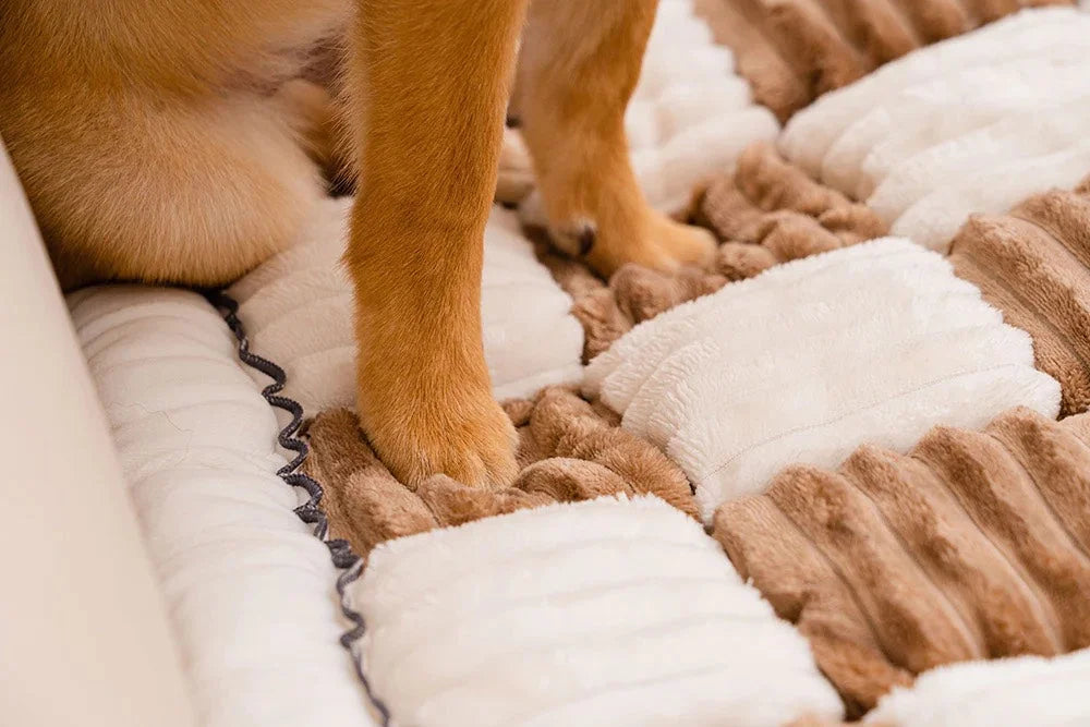 Plush chenille sofa cover for pets, featuring a soft and cushioned texture. Ideal for protecting furniture while providing comfort.