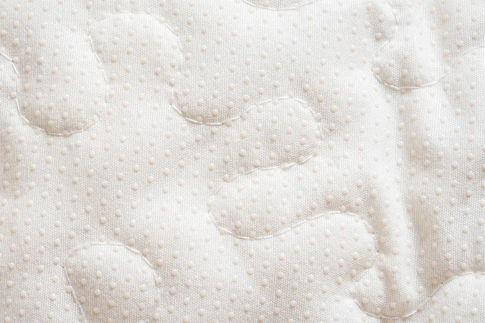 Close-up of a anti slip bottom in plush chenille sofa cover, designed for comfort and durability for pets.