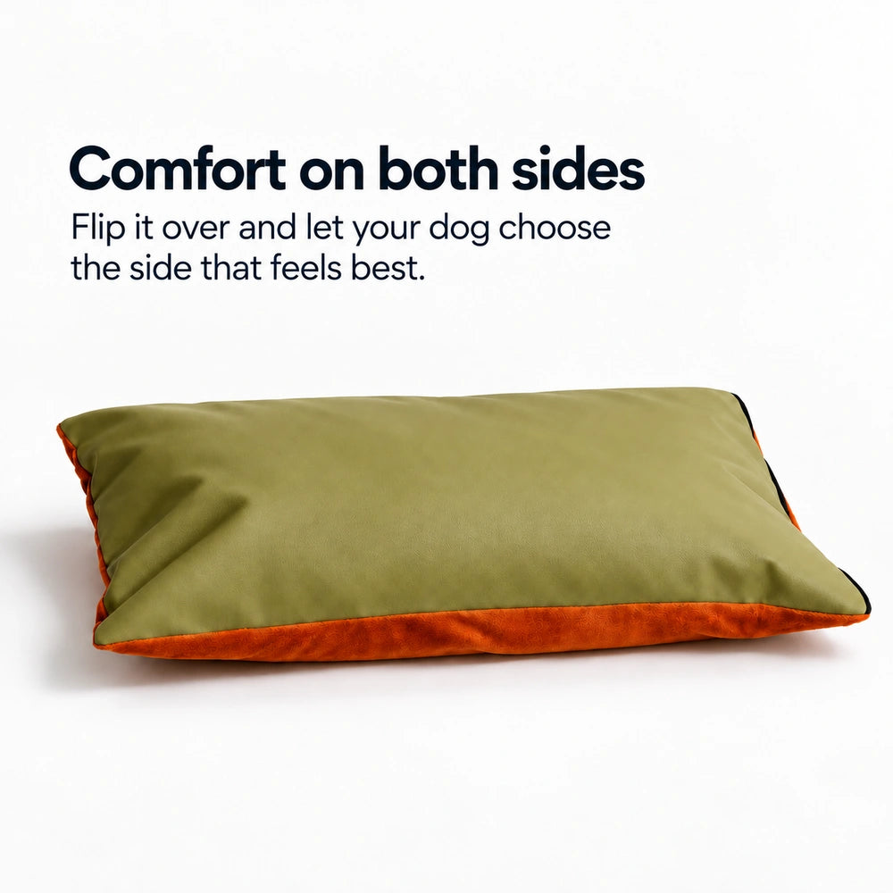 Reversible dog bed cushion with an olive green surface and a soft orange plush underside