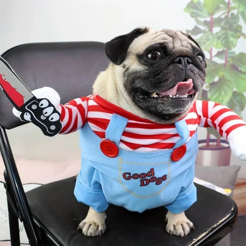 Pug dressed in a Chucky-themed Halloween dog costume, featuring a striped shirt, toy knife, and overalls for a spooky look.