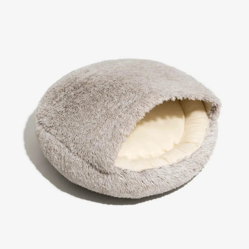 Soft and cozy shell-shaped pet bed in light coffee, perfect for cats and small dogs seeking comfort and warmth.