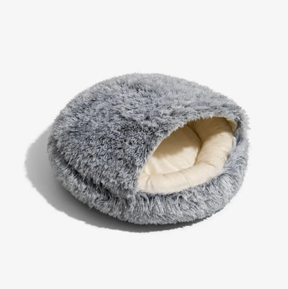 Cozy shell dog and cat bed with a soft, plush exterior and cream-colored interior for maximum comfort.